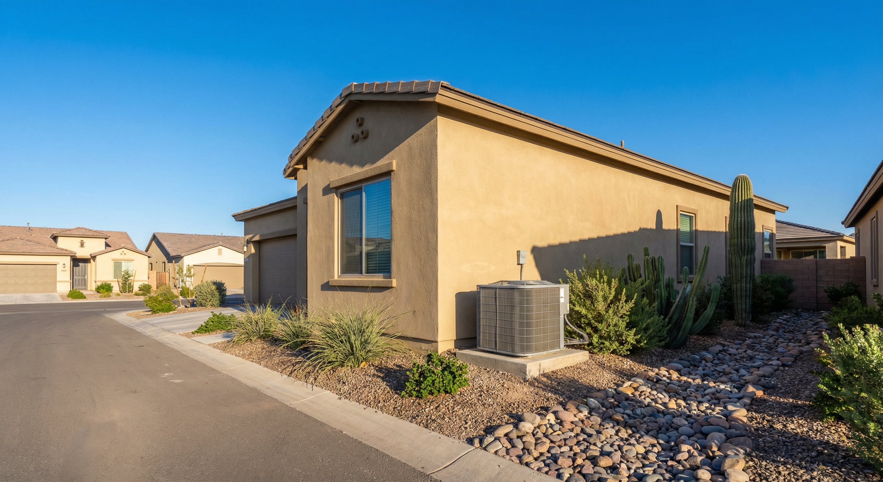 Phoenix stucco home with AC unit on side concrete pad